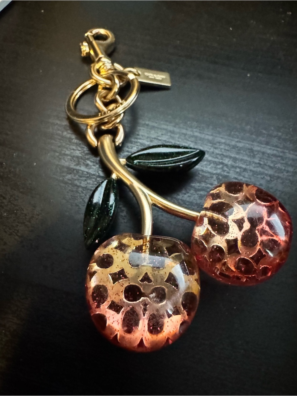 Coach Cherry Keychain with Pink Glass Cherries and Dark Green Leaves bag charm